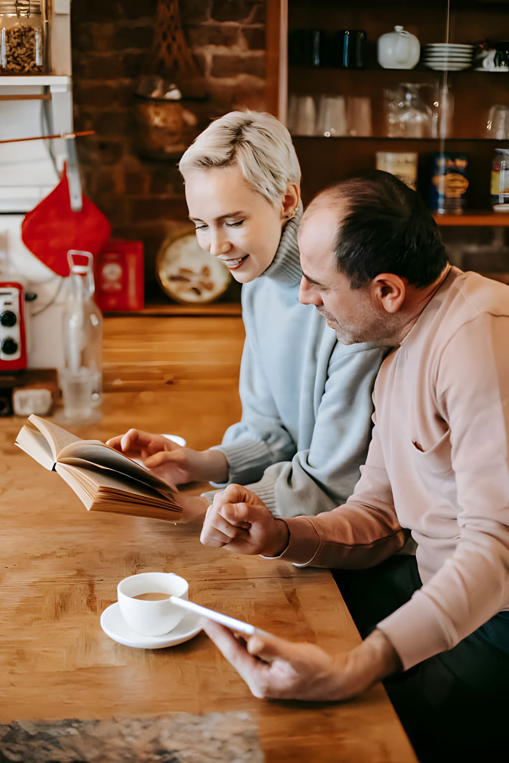 Couple reading a book together in a cozy environment