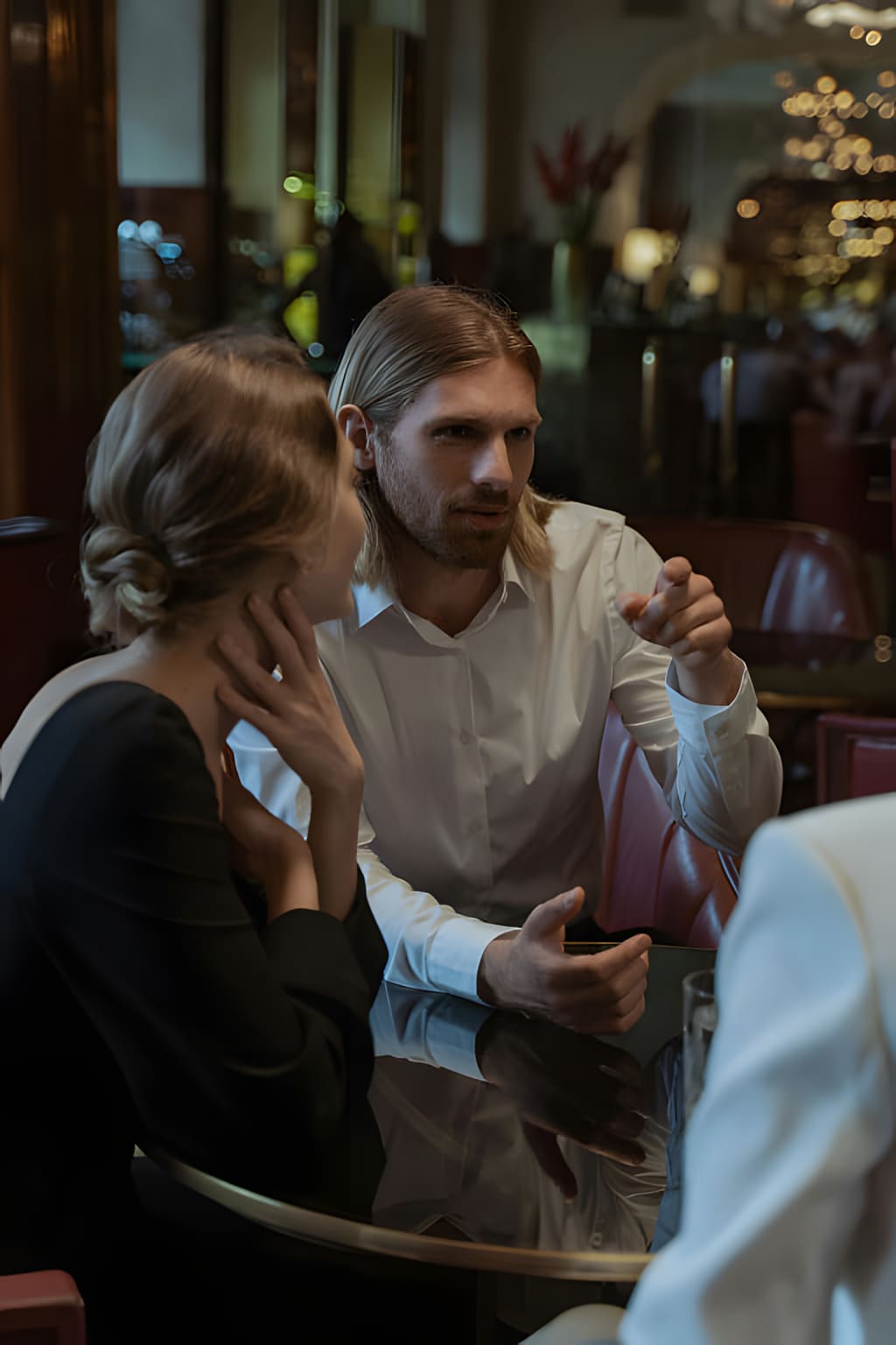 Man and woman having an engaging conversation in a softly lit room
