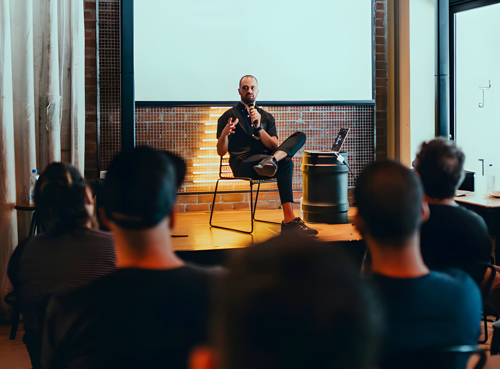 Speaker sharing ideas with a small audience